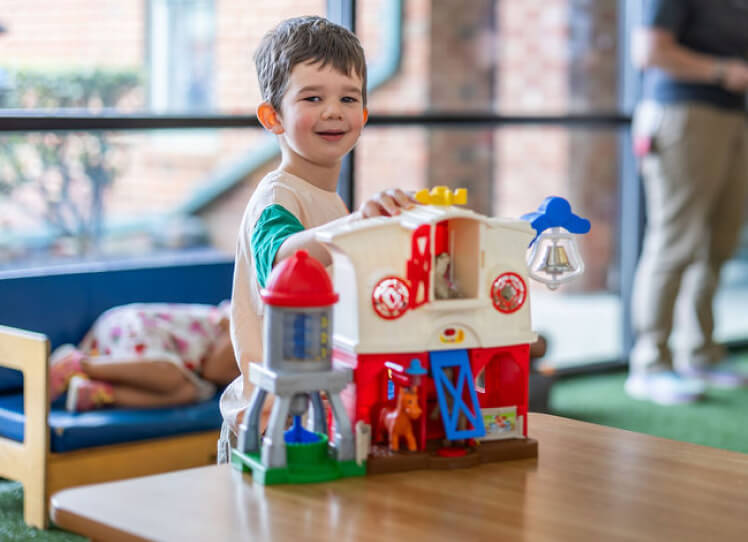 LeafSpring School student using toys to learn